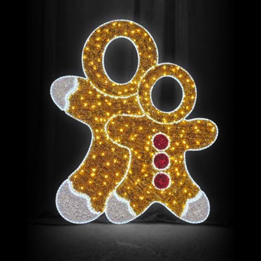 An illuminated gingerbread figure with a cut out face for photographs.