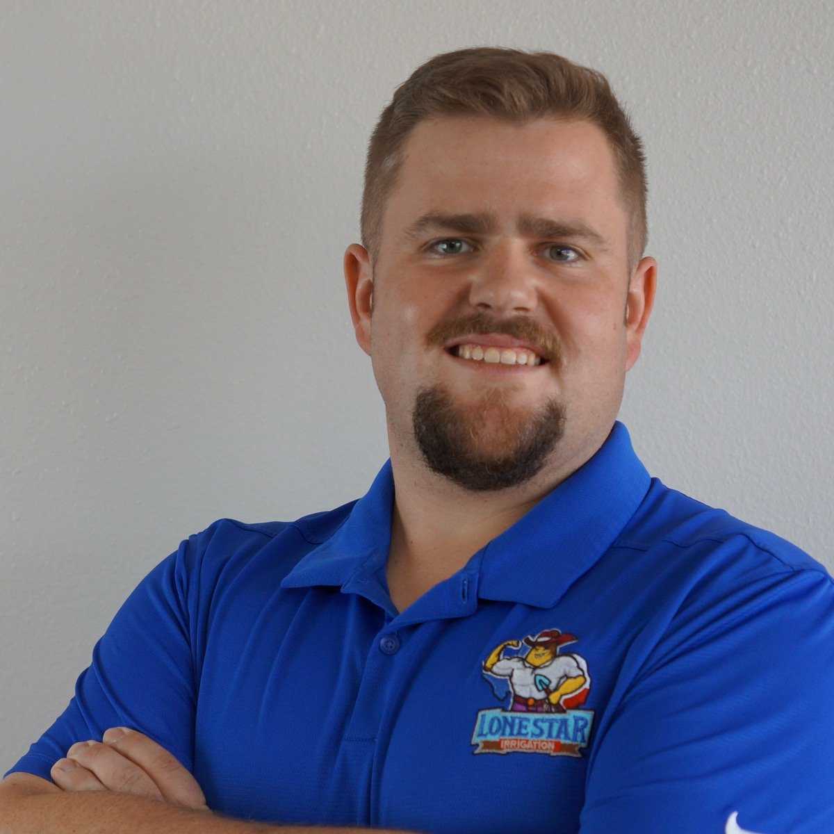 Ben Kannenberg, smiling, in a Lone Star Irrigation polo shirt